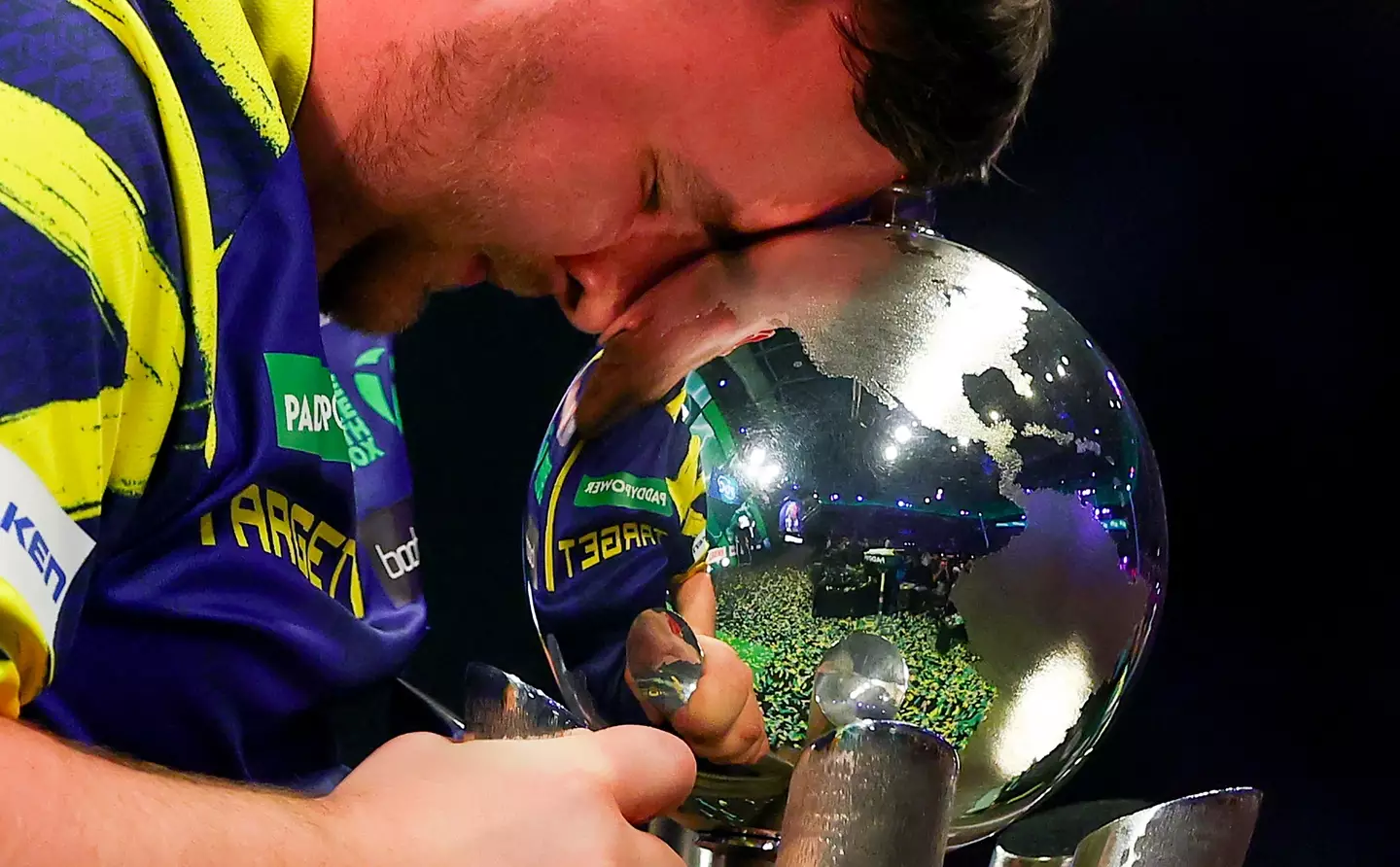 Littler celebrates winning back-to-back world titles. Image credit: Getty