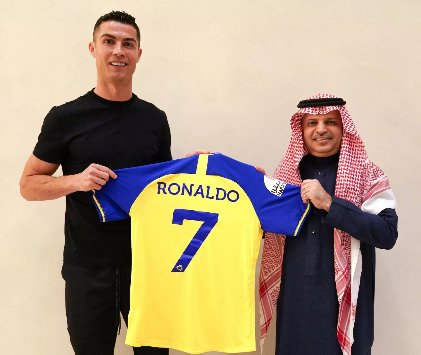 Ronaldo with club president Mossali Al-Muammar. Image: Alamy