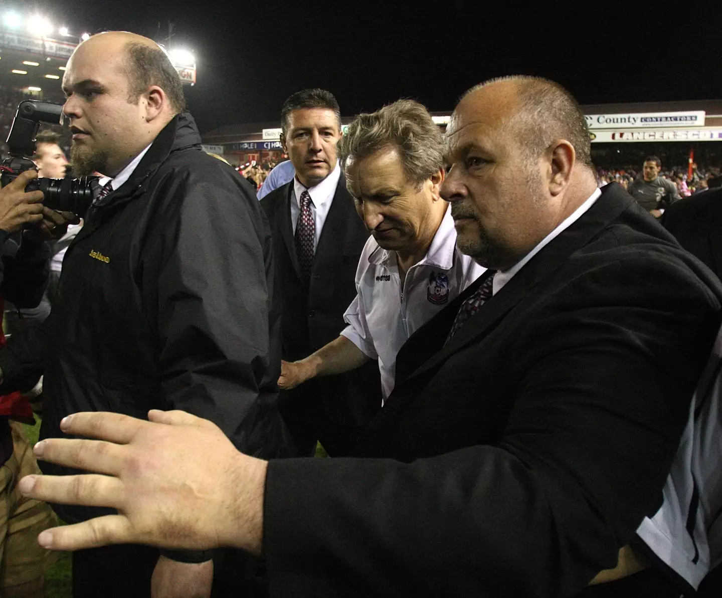 Neil Warnock escorted off the pitch at Ashton Gate. Image: Alamy 