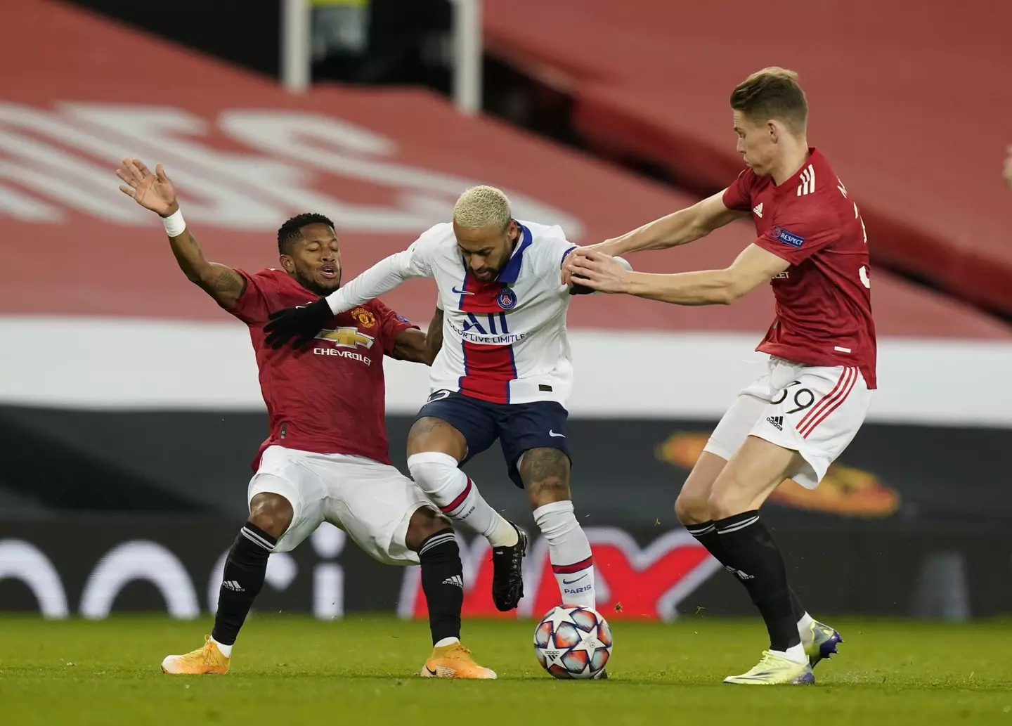 Manchester United's Scott McTominay and Fred against Neymar of PSG 