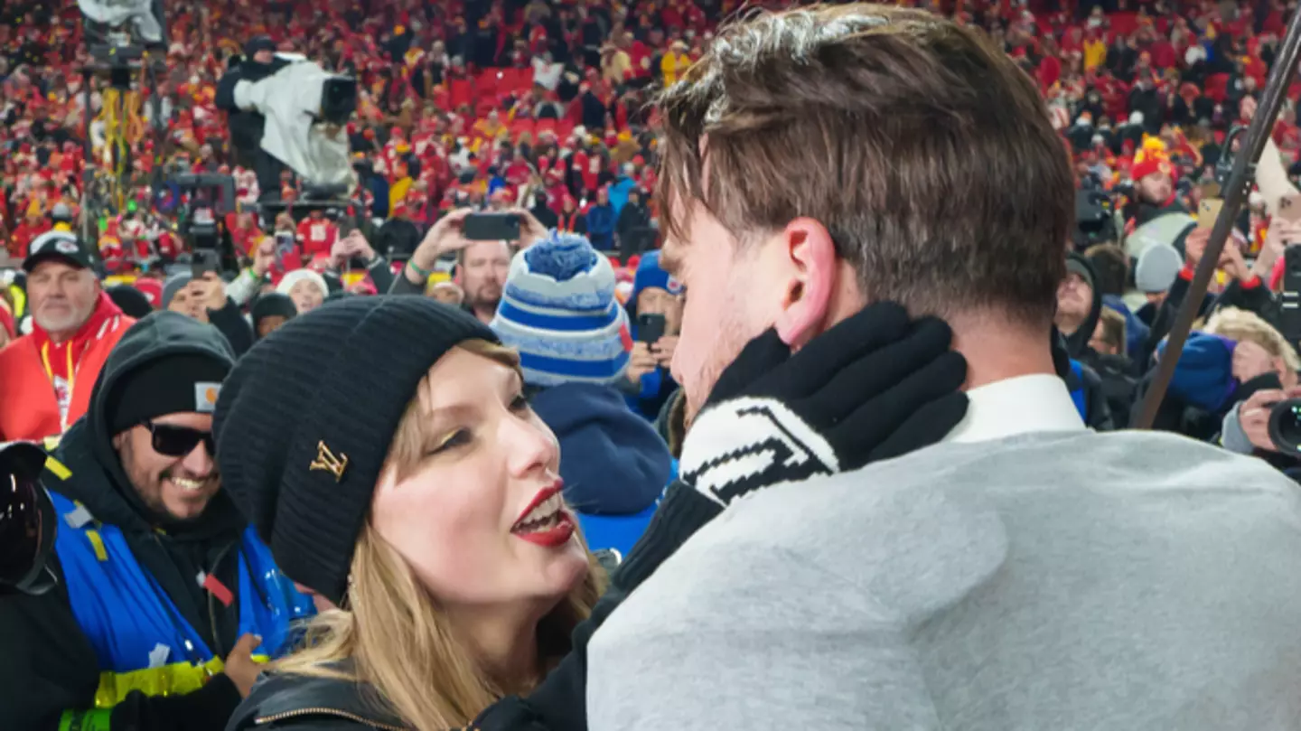 Taylor Swift and Travis Kelce embrace after the Chiefs' win