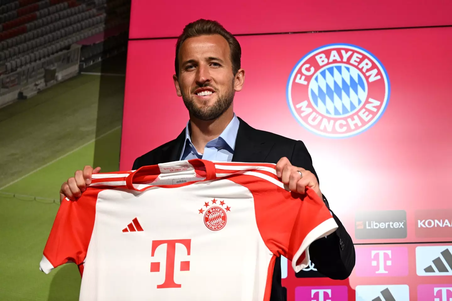 Harry Kane poses for a photo during his official unveiling. Image: Getty
