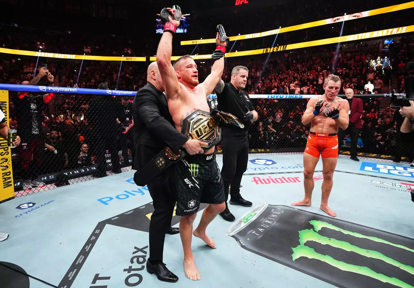 Dana White wraps the interim UFC lightweight belt around Justin Gaethje's waist following his win over Paddy Pimblett at UFC 324. Image: Getty