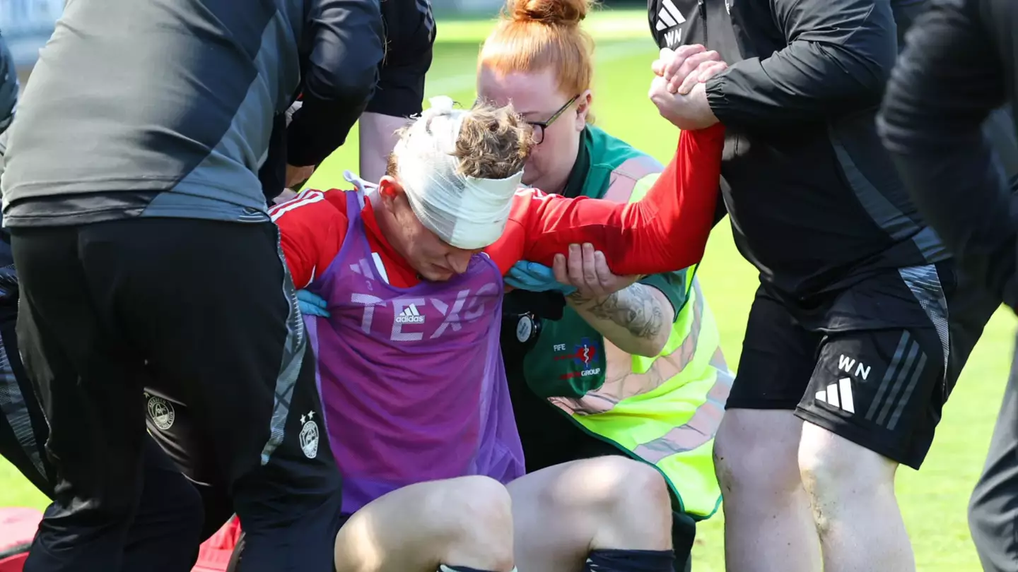 Footballer left covered in blood after being hit by a seat thrown by his own fans as disgraceful scenes unfold