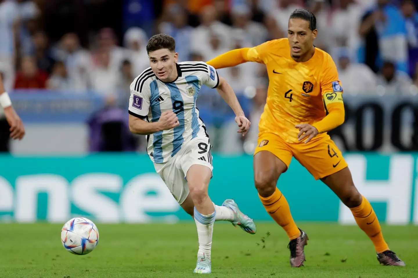 Julian Alvarez and Virgil van Dijk during a World Cup clash. Image: Getty