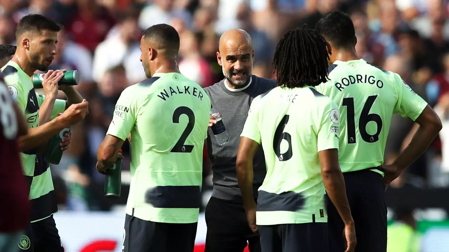 Pep Guardiola's briefs his Manchester City players.