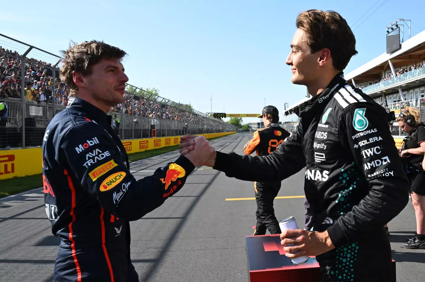 Max Verstappen and George Russell at the 2025 Canadian GP (credit: getty)