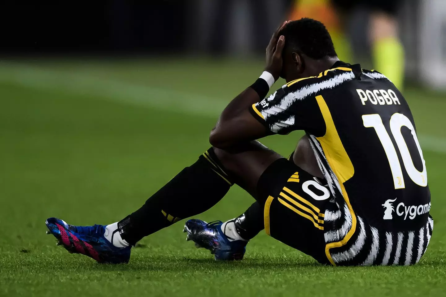 Paul Pogba cuts a frustrated figure after suffering an injury. Image: Alamy