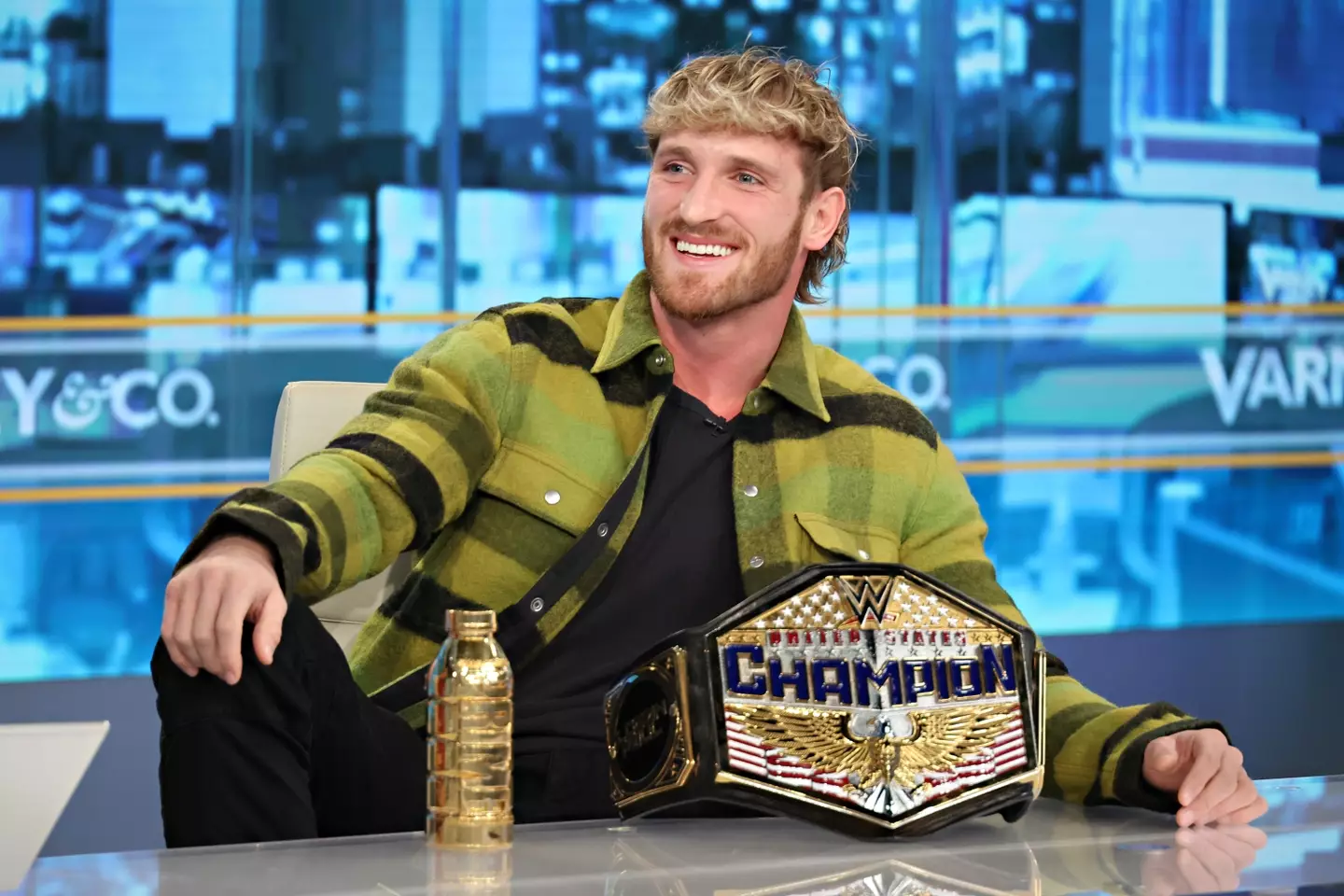 Paul with his United States Championship during a media appearance. (Image