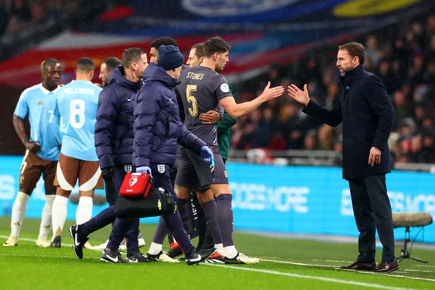 Gareth Southgate speaks to John Stones as he leaves the pitch following an injury. Image: Getty