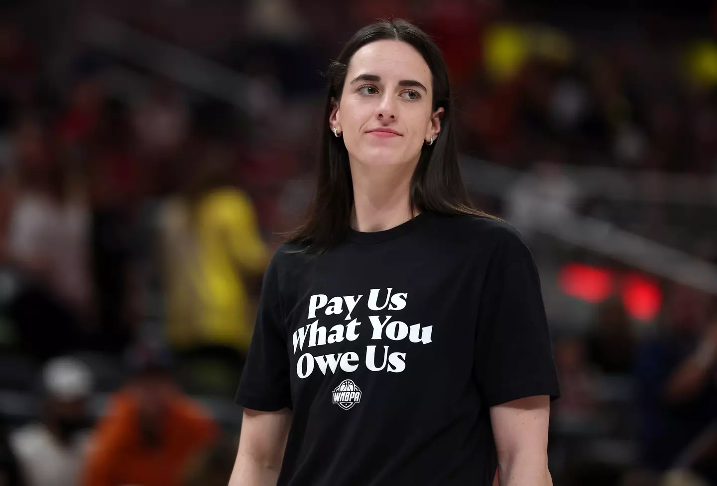 Caitlin Clark wore a t-shirt to protest the gap in pay between men and women in basketball. (Image: Steph Chambers / Staff via Getty)