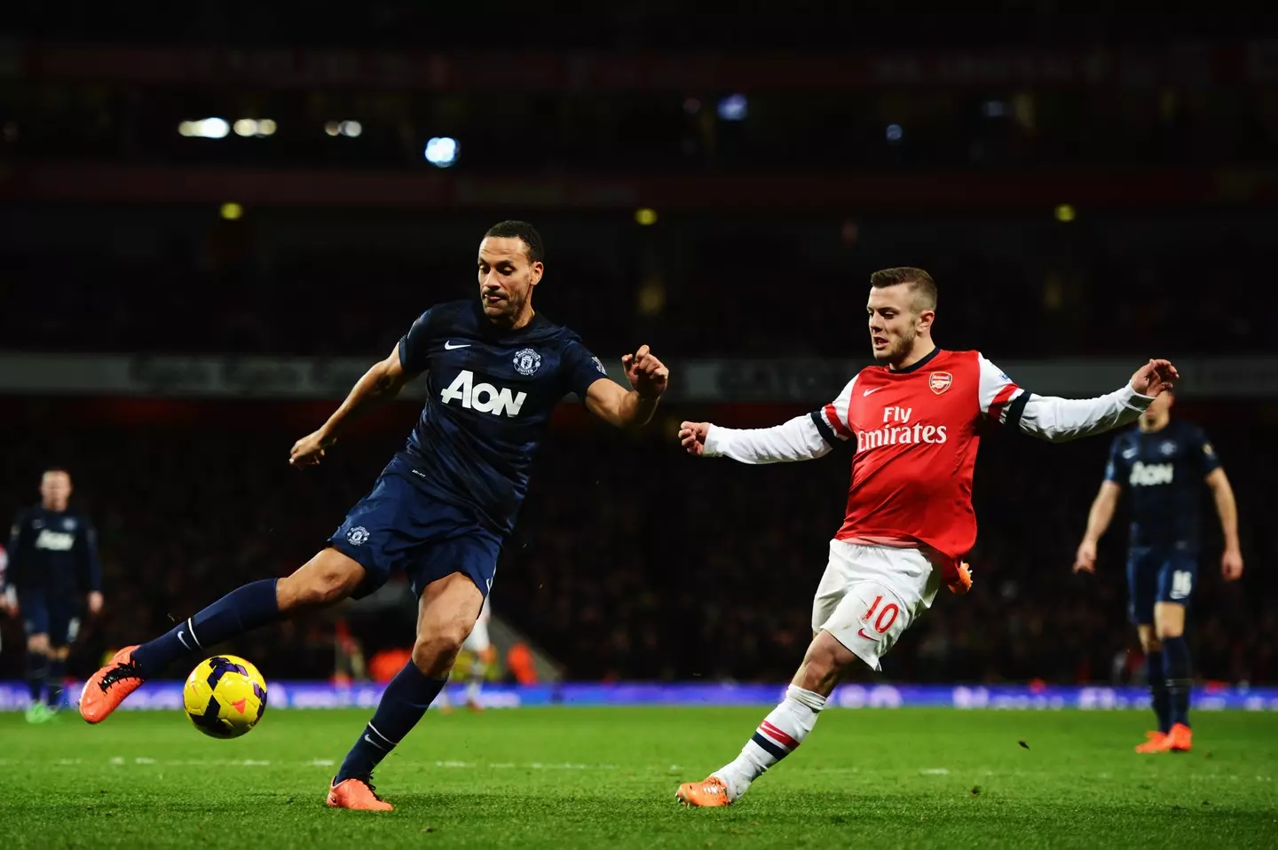 Rio Ferdinand and Jack Wilshere during a Premier League clash. Image: Getty