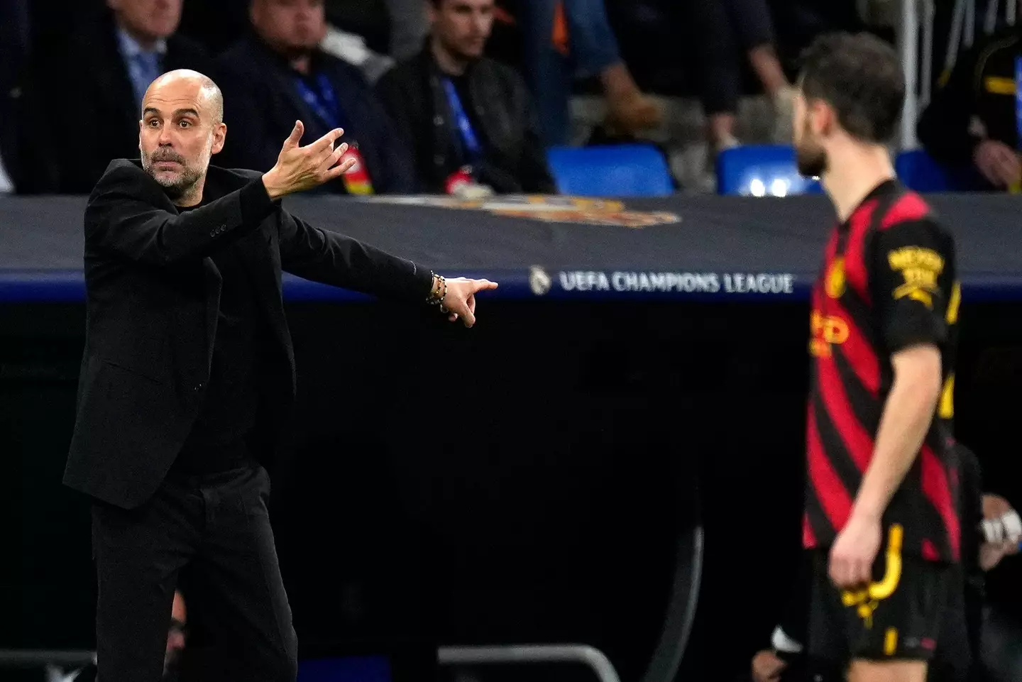 Pep Guardiola gestures on the touchline. Image: Alamy