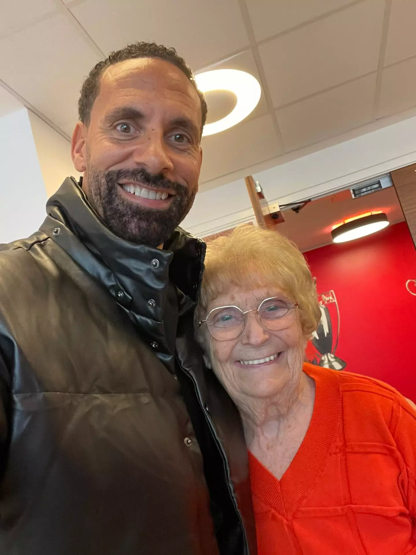 Ferdinand with long-serving receptionist Kath, who has been at United for 56 years. Image credit: Twitter/@rioferdy5