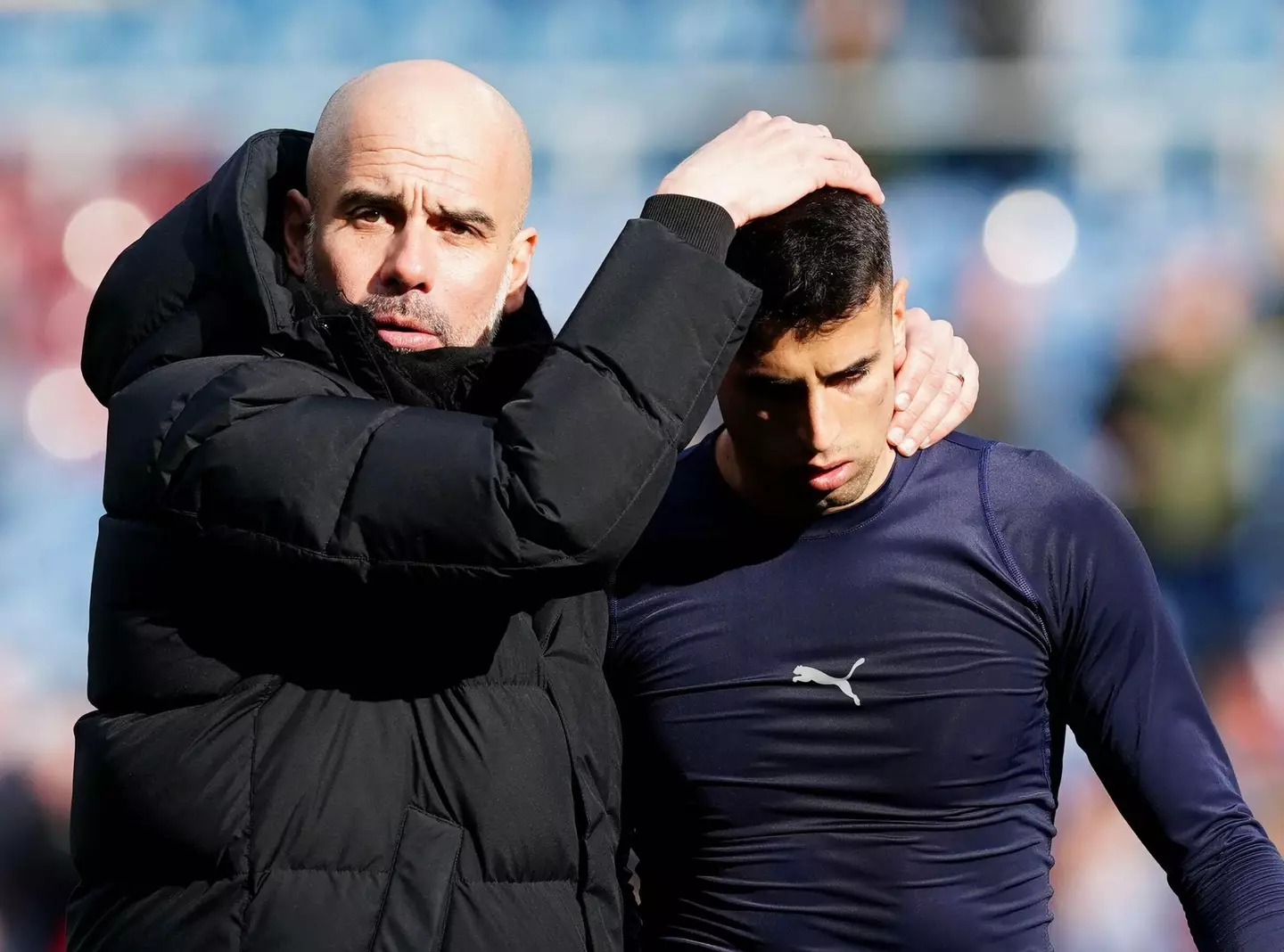 Pep Guardiola with Joao Cancelo. Image: Alamy