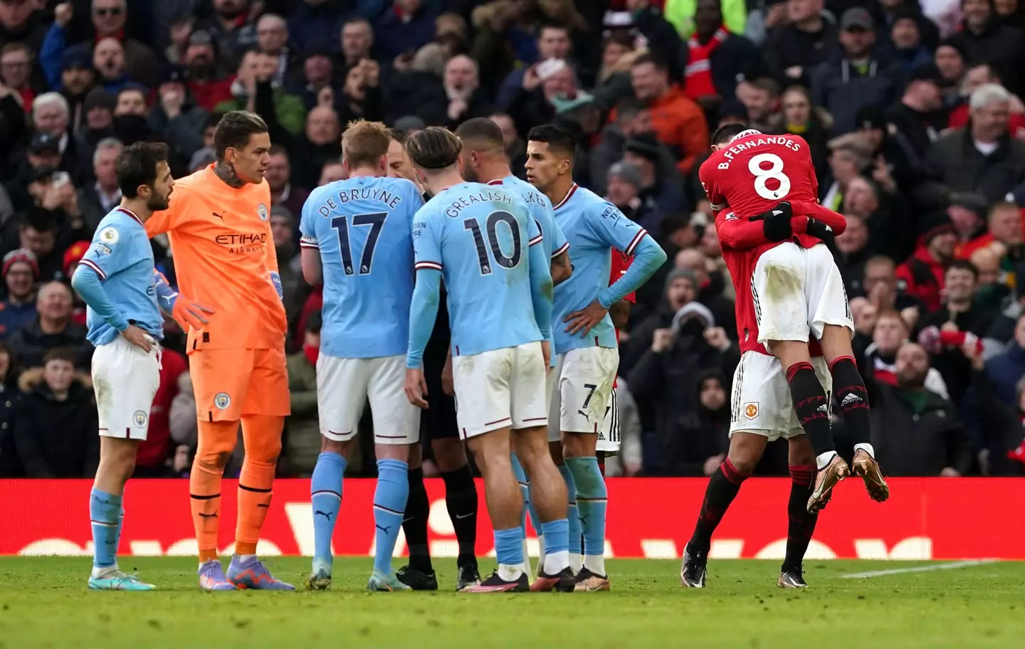 Fernandes celebrates his goal whilst City players question the referee. Image: Alamy