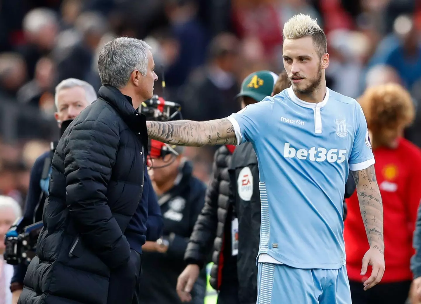 Arnautovic and Mourinho embrace during their times at Stoke City and Manchester United. (