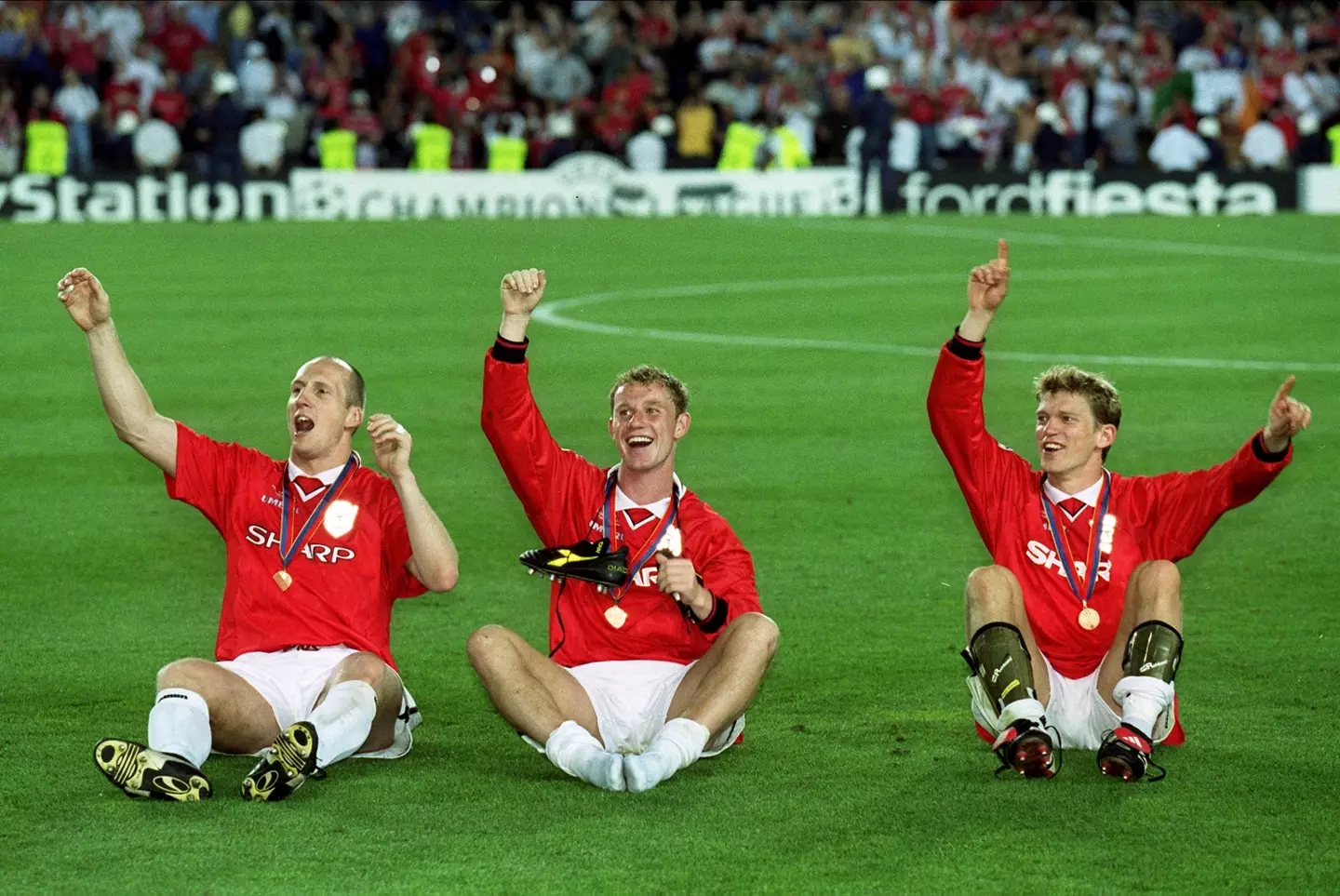 Jaap Stam, Nicky Butt and Jesper Blomqvist celebrate winning the 1999 Champions League final. Image credit: Getty