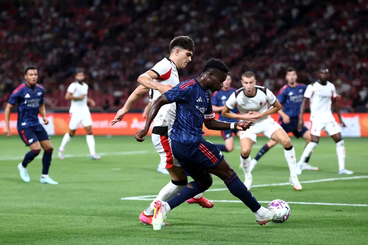 Arsenal beat AC Milan in their first pre-season match. (Image: Yong Teck Lim / Staff via Getty)