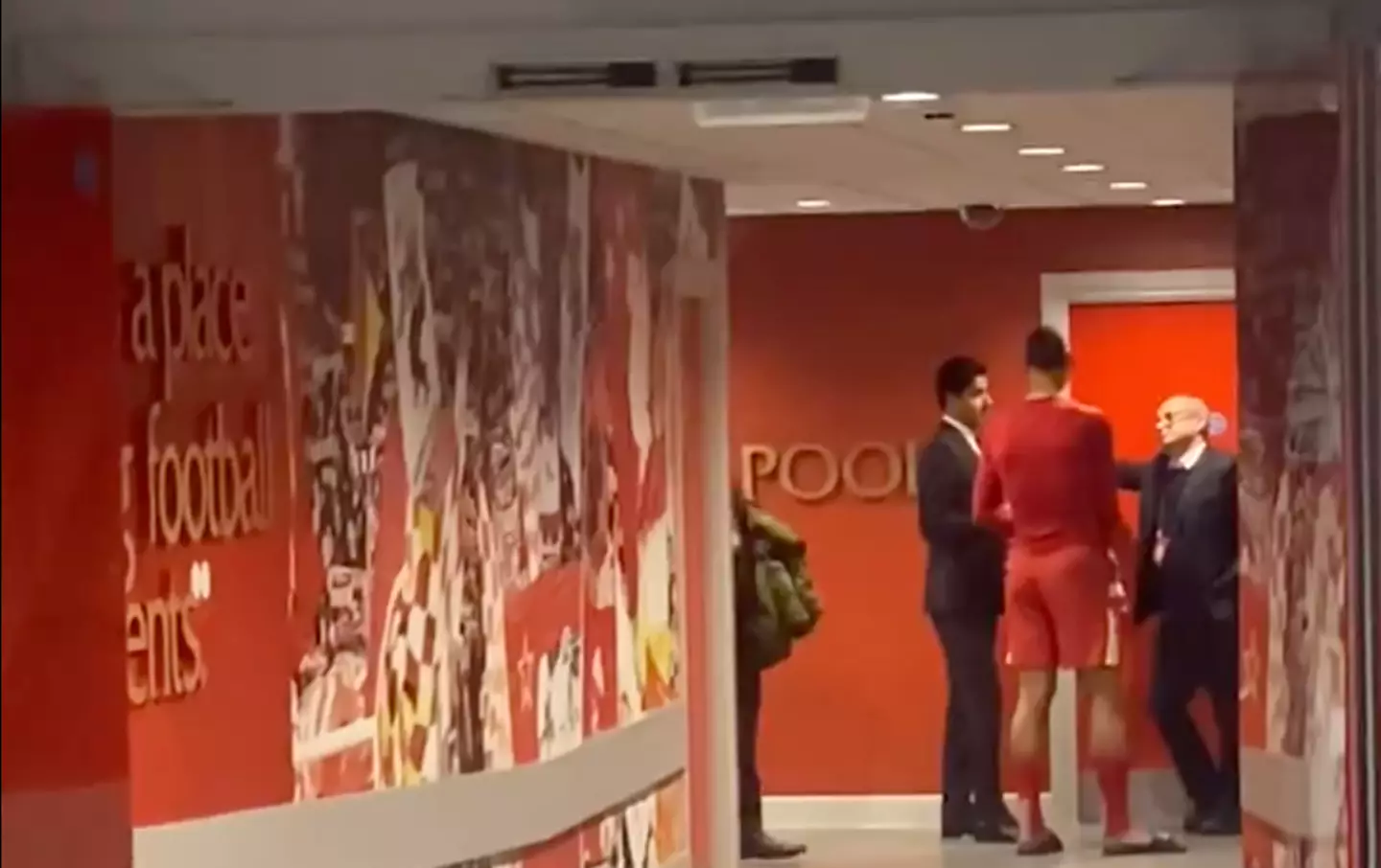 Van Dijk talking to Luis Campos (right) and Nasser Al-Khelaifi (left) in the Anfield tunnel (Image: Twitter/@CasseJosue)