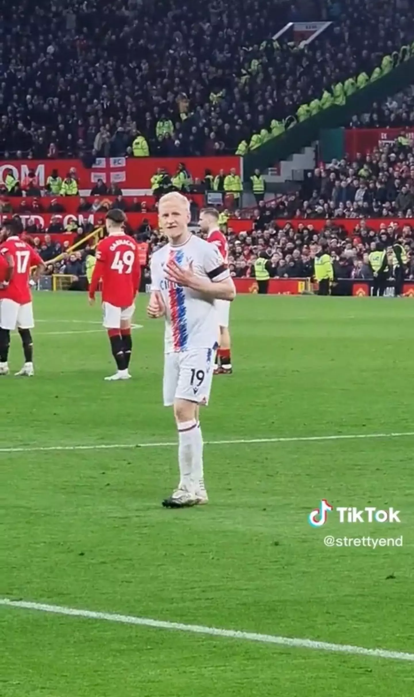 Hughes makes a number six gesture with his hands - a reference to the number of Champions League trophies Liverpool have won. Image credit: TikTok/strettyend