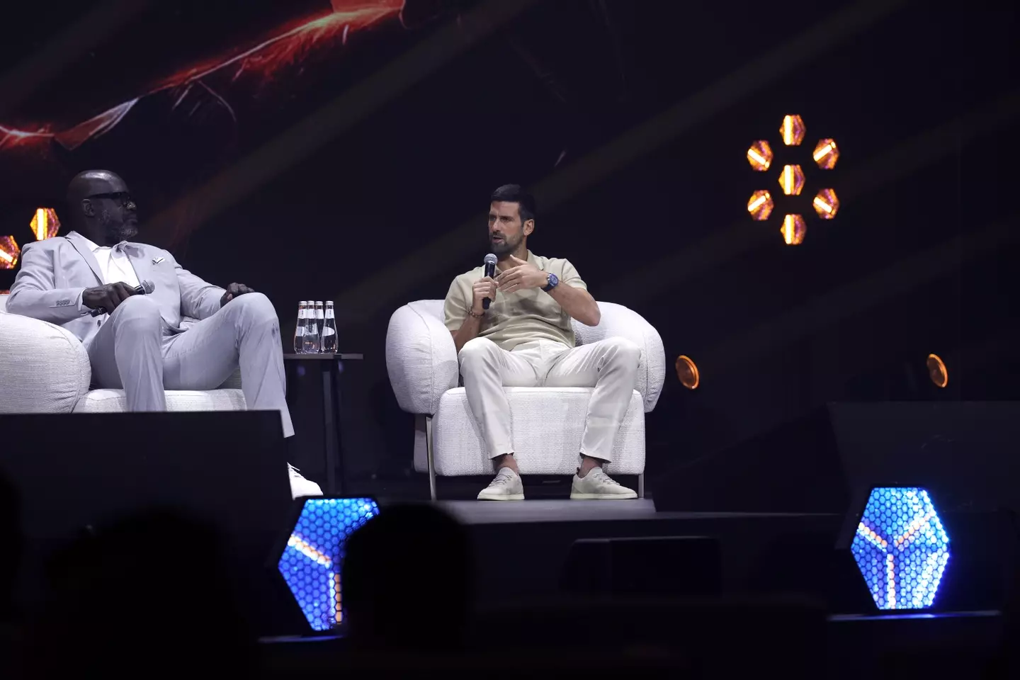 Shaquille O’Neal sat next to Novak Djokovic. Image: Wed Al Shehri / Stringer via Getty