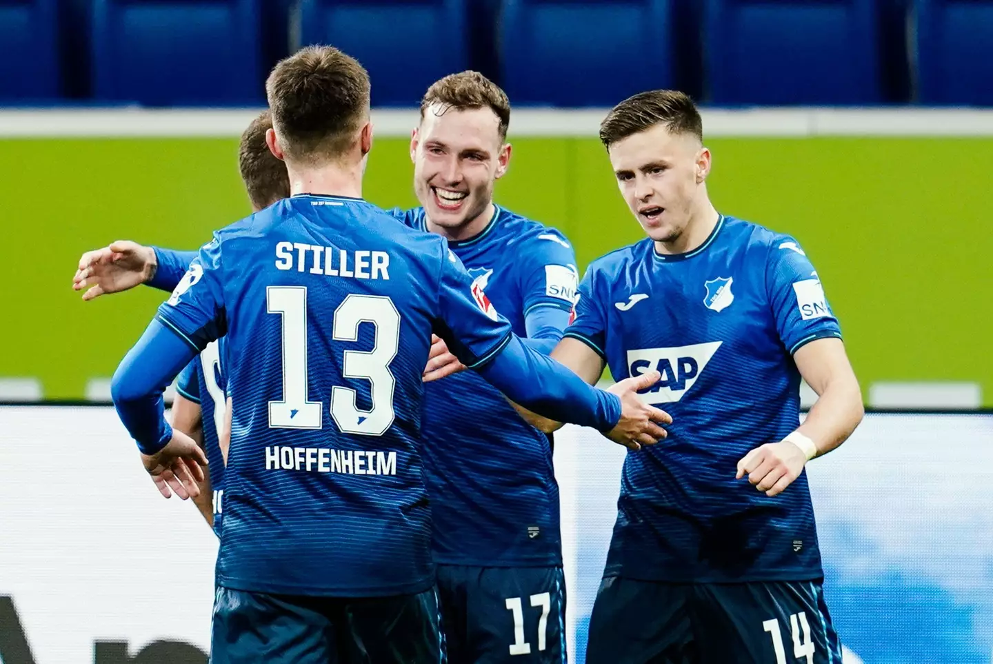 David Raum celebrates with teammates after scoring for Hoffenheim. (Alamy)