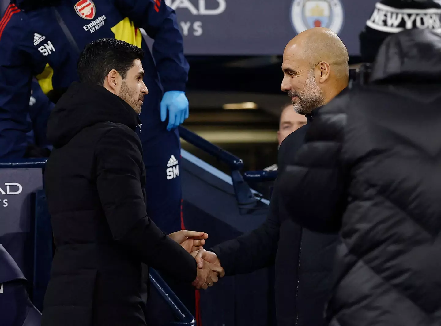 Pep Guardiola and Mikel Arteta embrace before their FA Cup tie. Image: Alamy 
