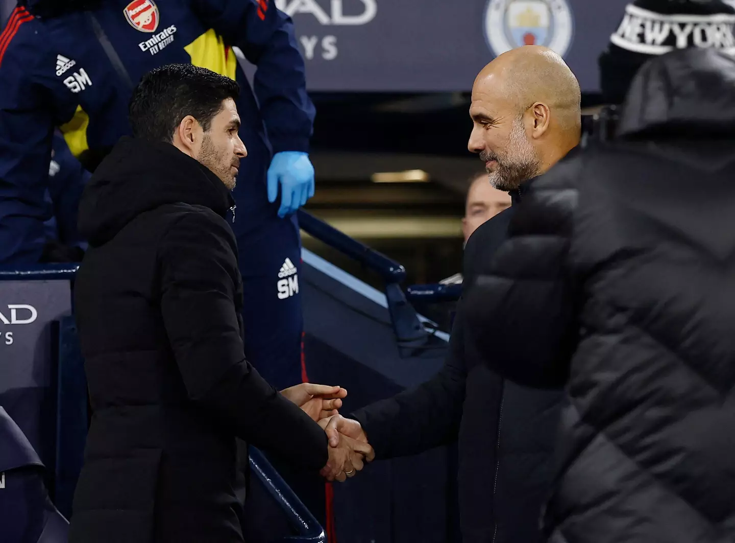 Pep Guardiola and Mikel Arteta embrace before their FA Cup tie. Image: Alamy