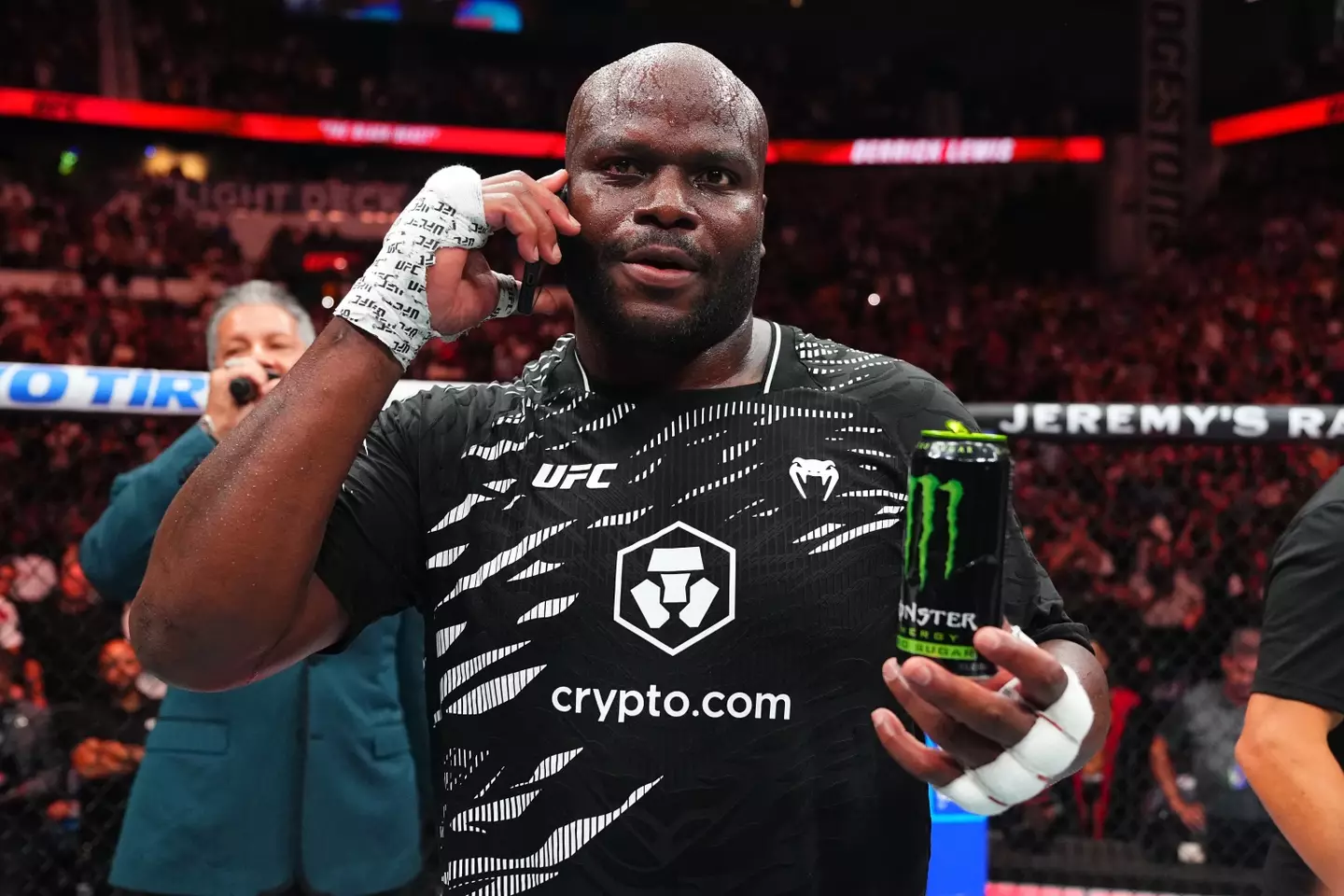 Derrick Lewis takes a call from Donald Trump after his win over Tallison Teixeira. Image: Getty