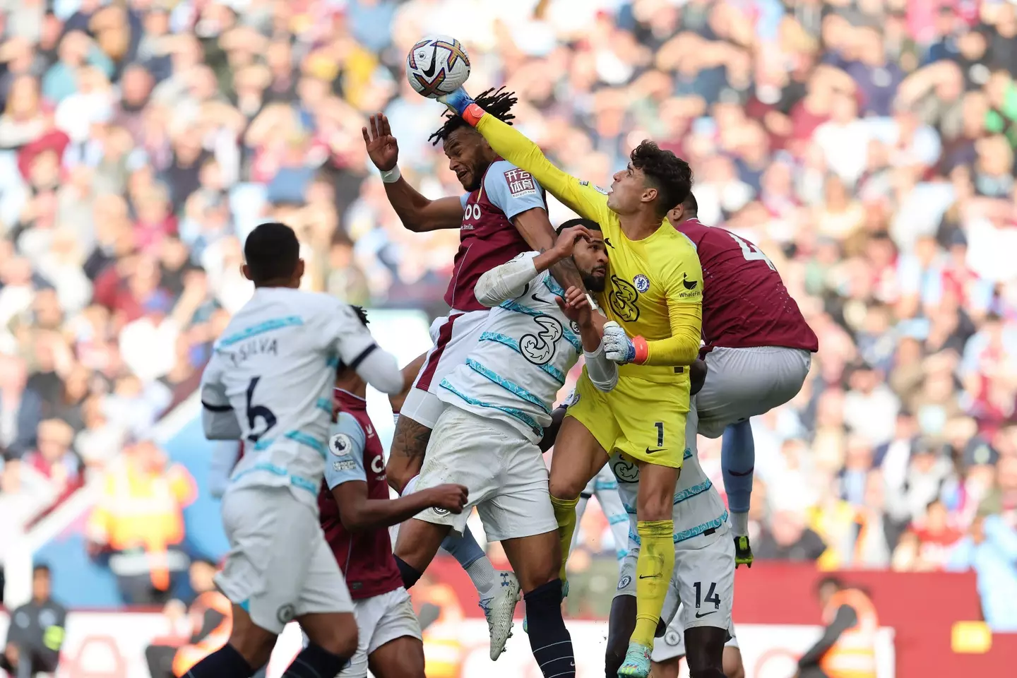 Kepa Arrizabalaga, the goalkeeper of Chelsea punches clear off the head of Tyrone Mings of Aston Villa. (Alamy)