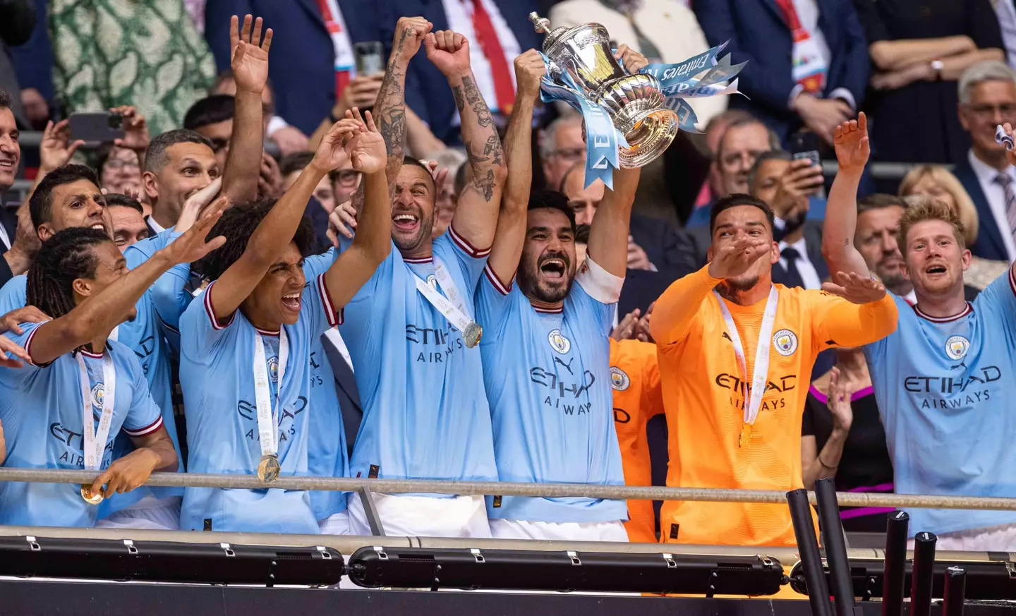 Captain fantastic Gundogan lifts the FA Cup trophy but he doesn't have a medal. Image: Alamy