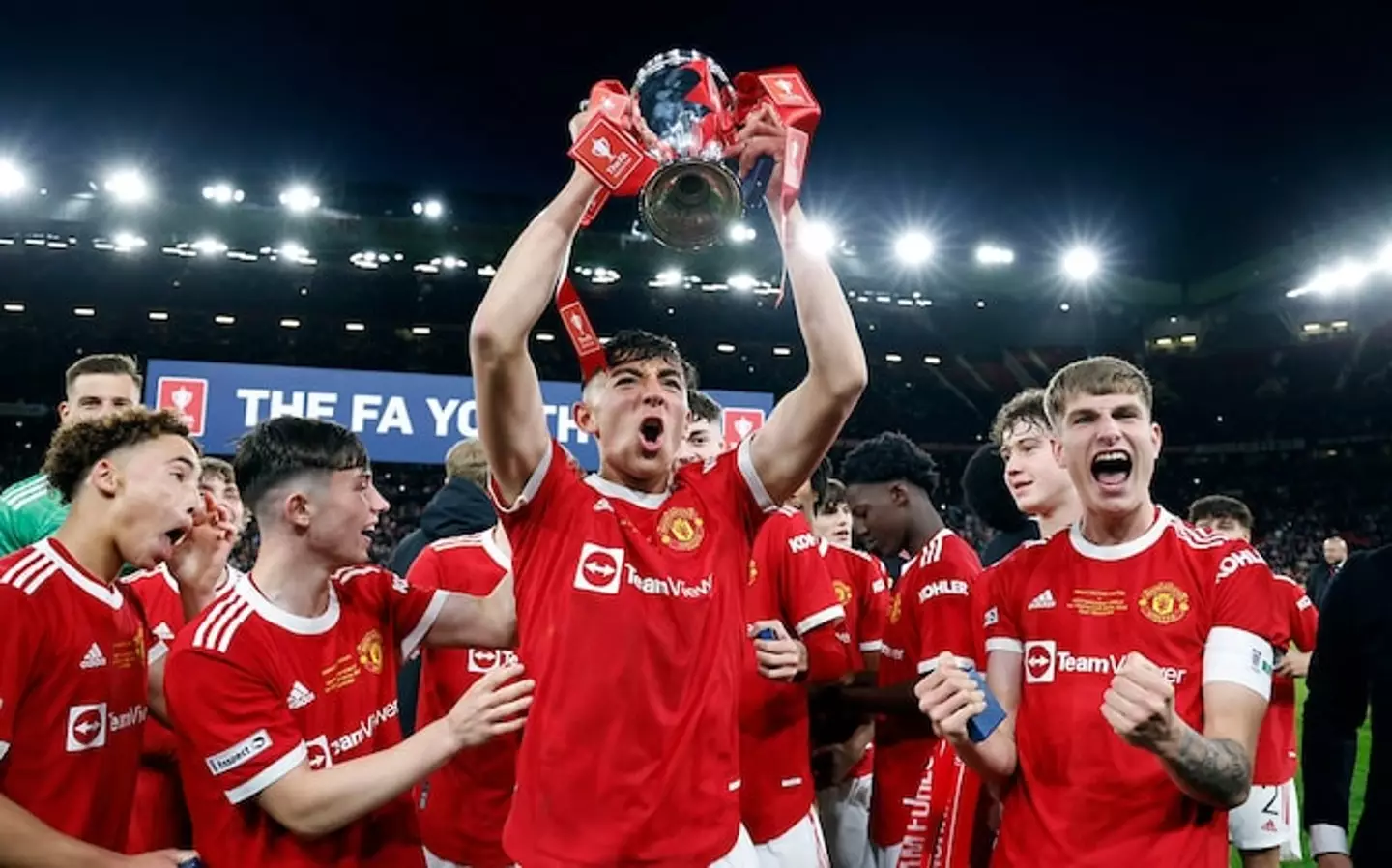 Manchester United players celebrate with the FA Youth Cup trophy after beating Nottingham Forest in the final at Old Trafford |
