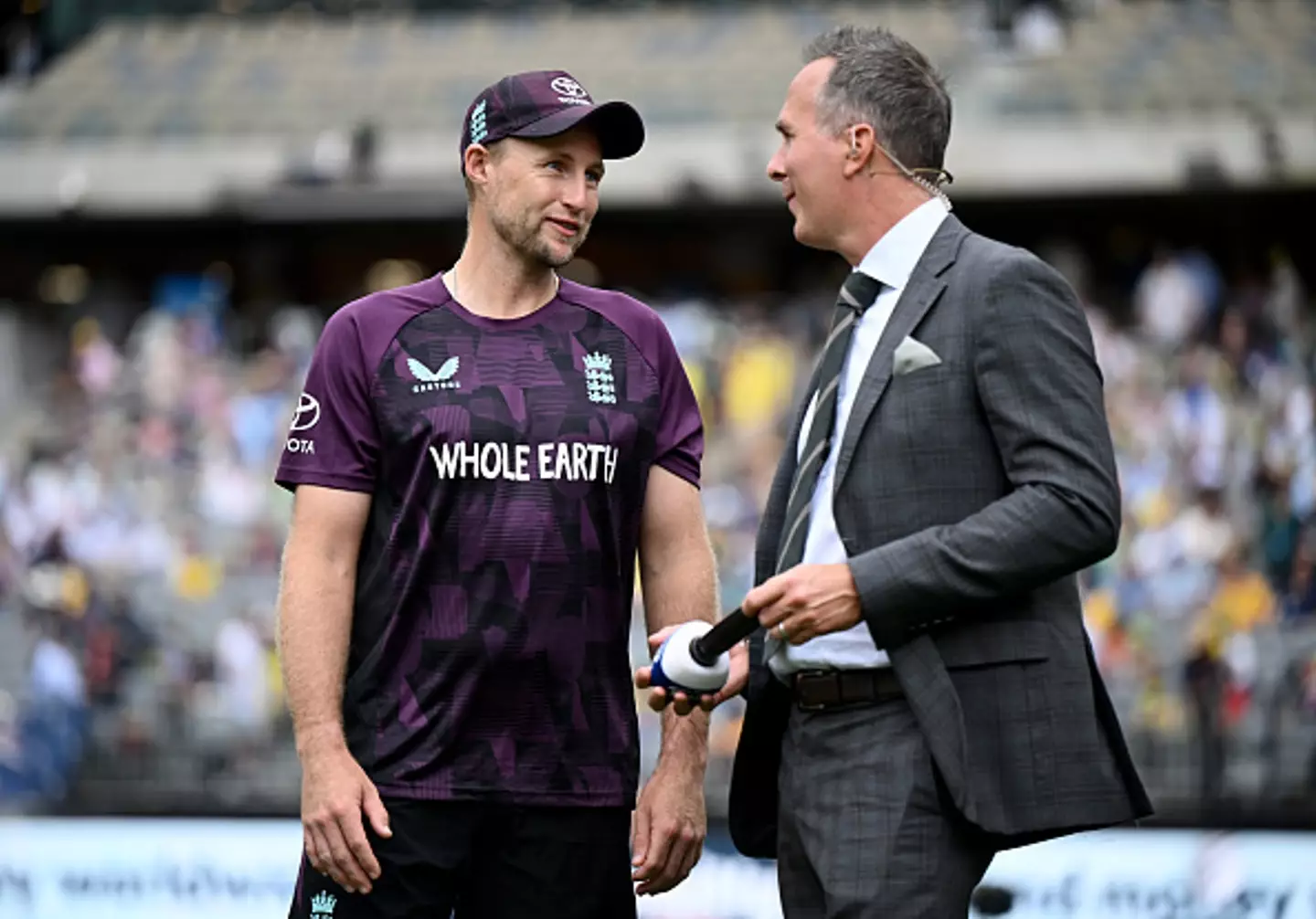 Michael Vaughan speaking with fellow former England captain Joe Root in Brisbane (Image: Getty)