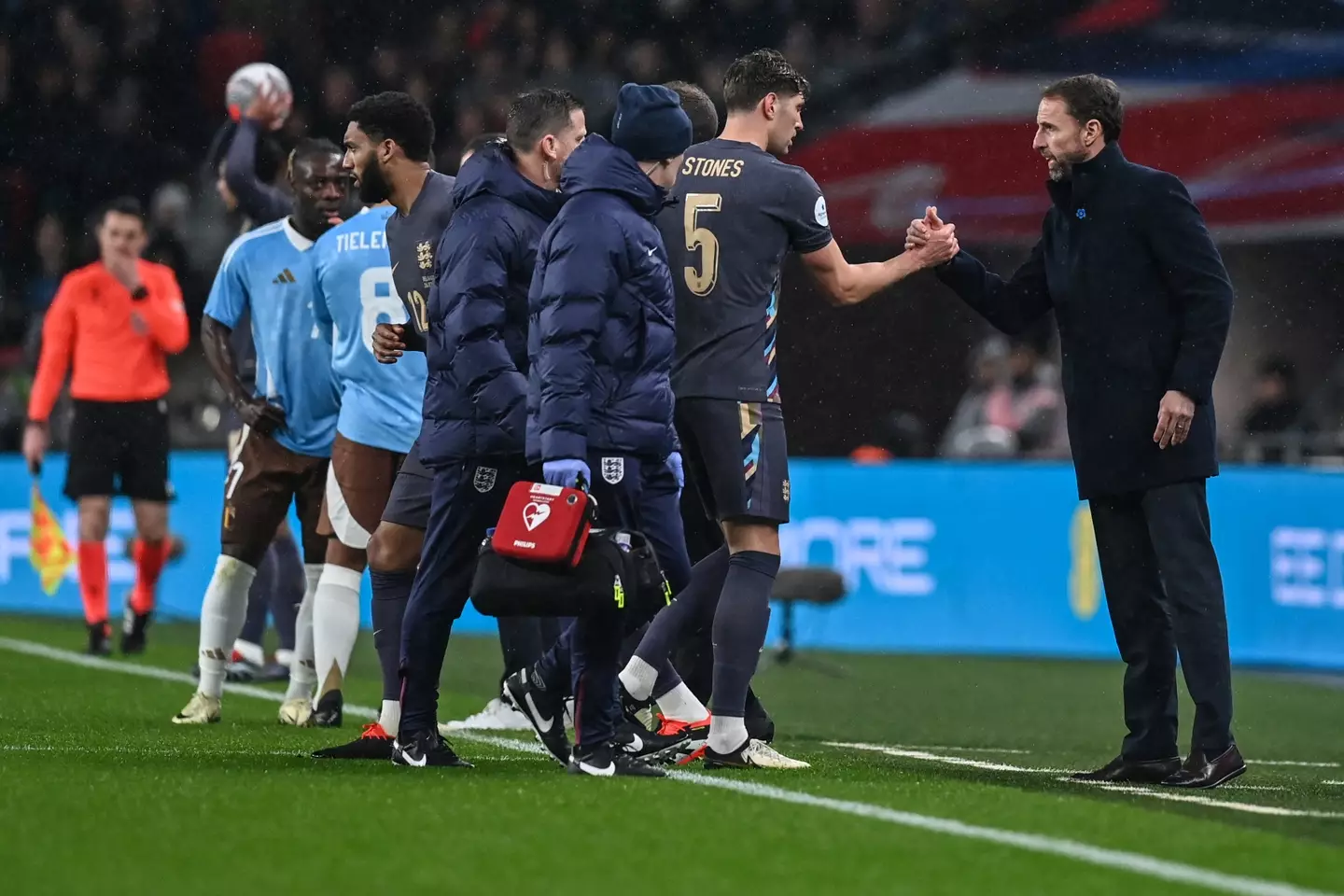 John Stones leaves the pitch after picking up an injury. Image: Getty