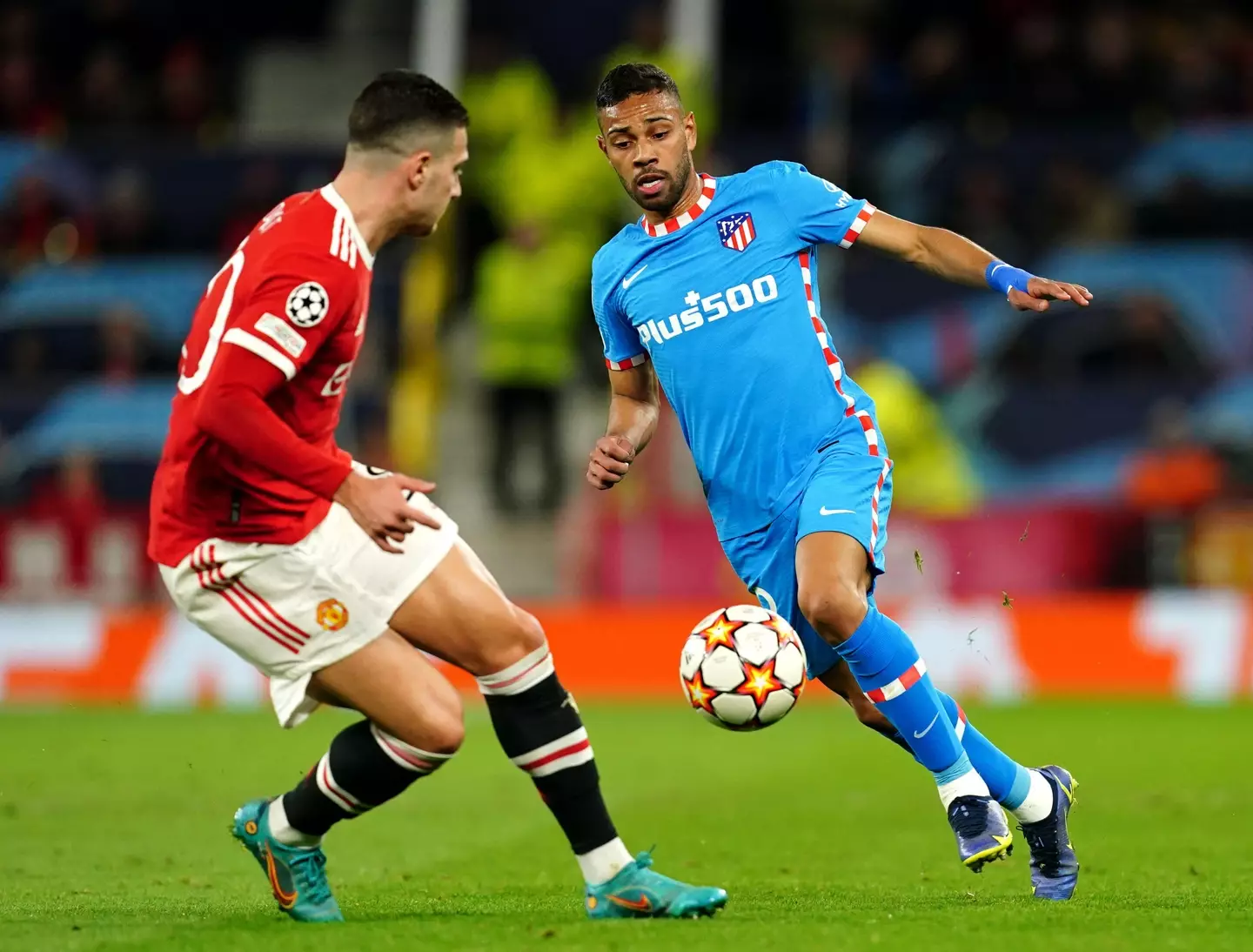 Diogo Dalot defends against Atletico Madrid's Renan Lodi in the Champions League at Old Trafford |