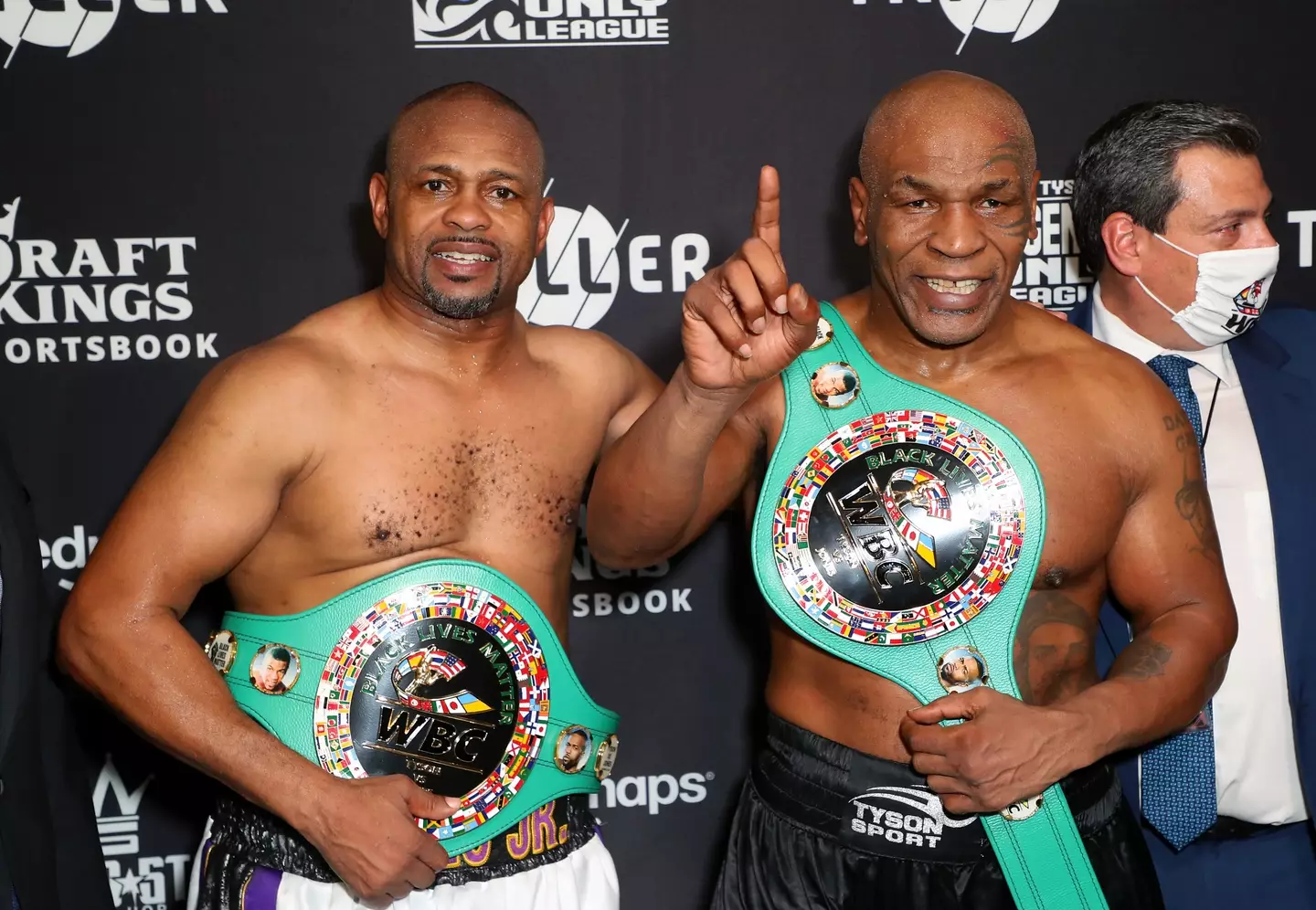 Mike Tyson and Roy Jones Jr with WBC titles after their exhibition bout. Image: Getty