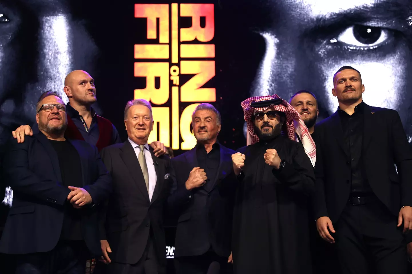 Tyson Fury and Oleksandr Usyk pose for photos at their pre-fight press conference. Image: Getty