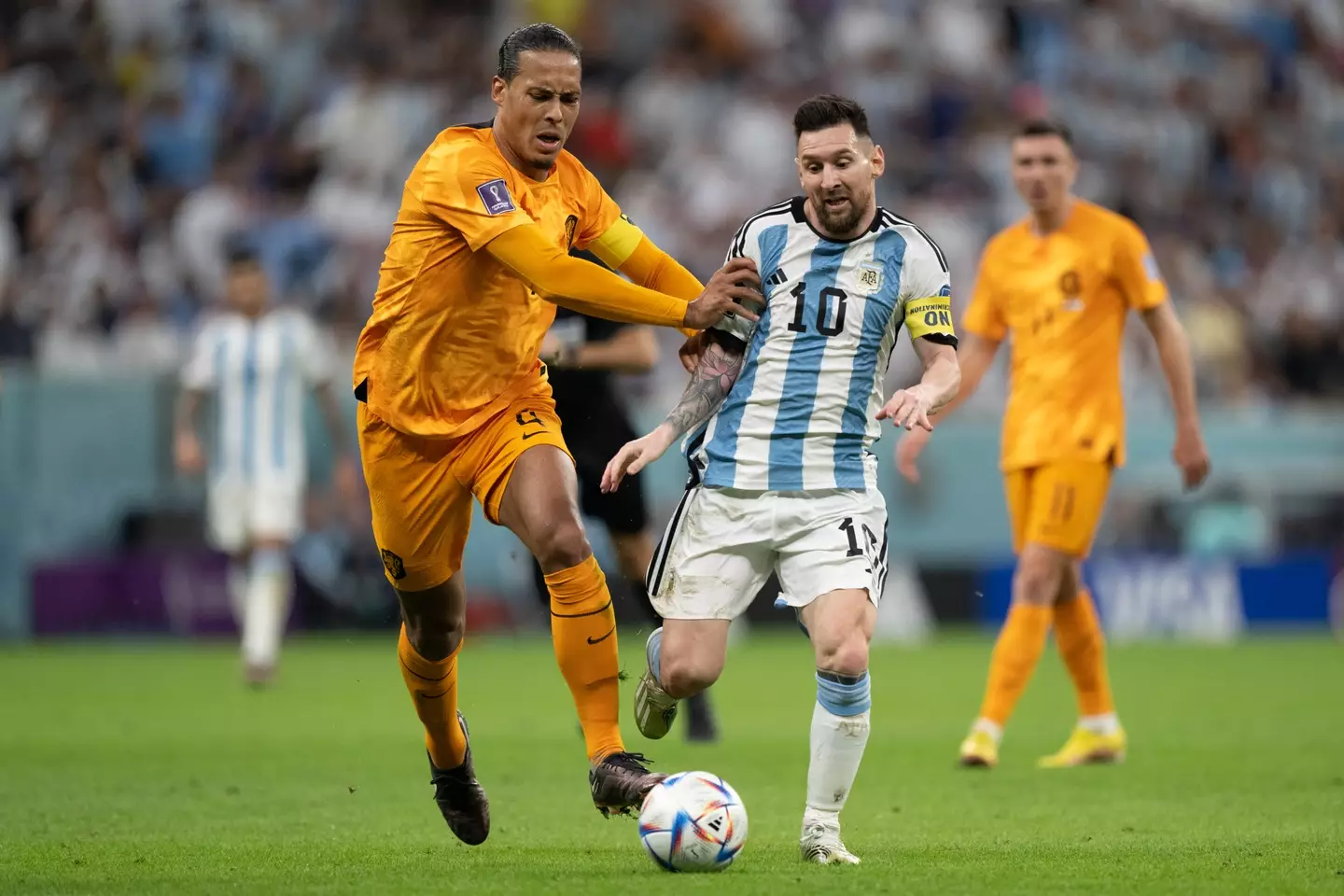 Virgil van Dijk and Lionel Messi duel for the ball during a World Cup clash. Image: Getty