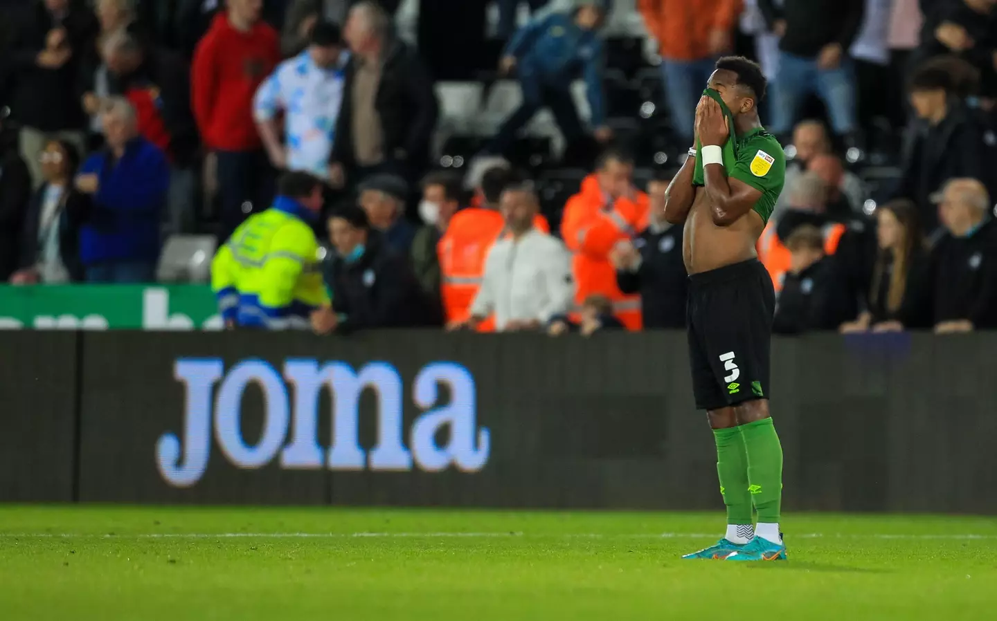 Ethan Laird in disappointment after AFC Bournemouth drew 3-3 against Swansea City |