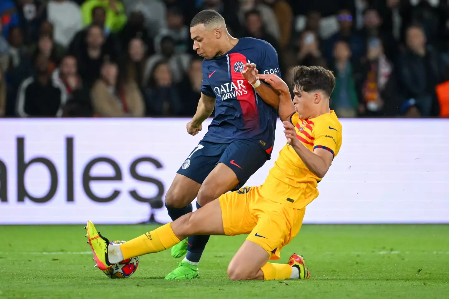 Pau Cubarsi tackles Kylian Mbappe. Image: Getty