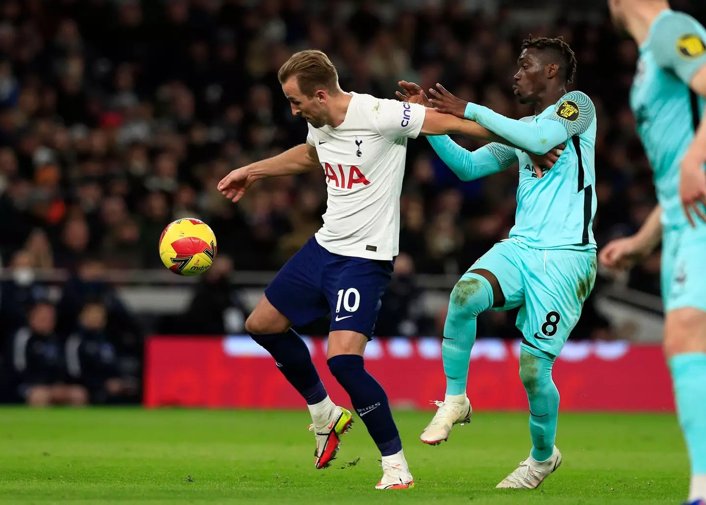 Harry Kane of Tottenham Hotspur holds off Yves Bissouma of Brighton in an FA Cup clash. Image credit: Alamy