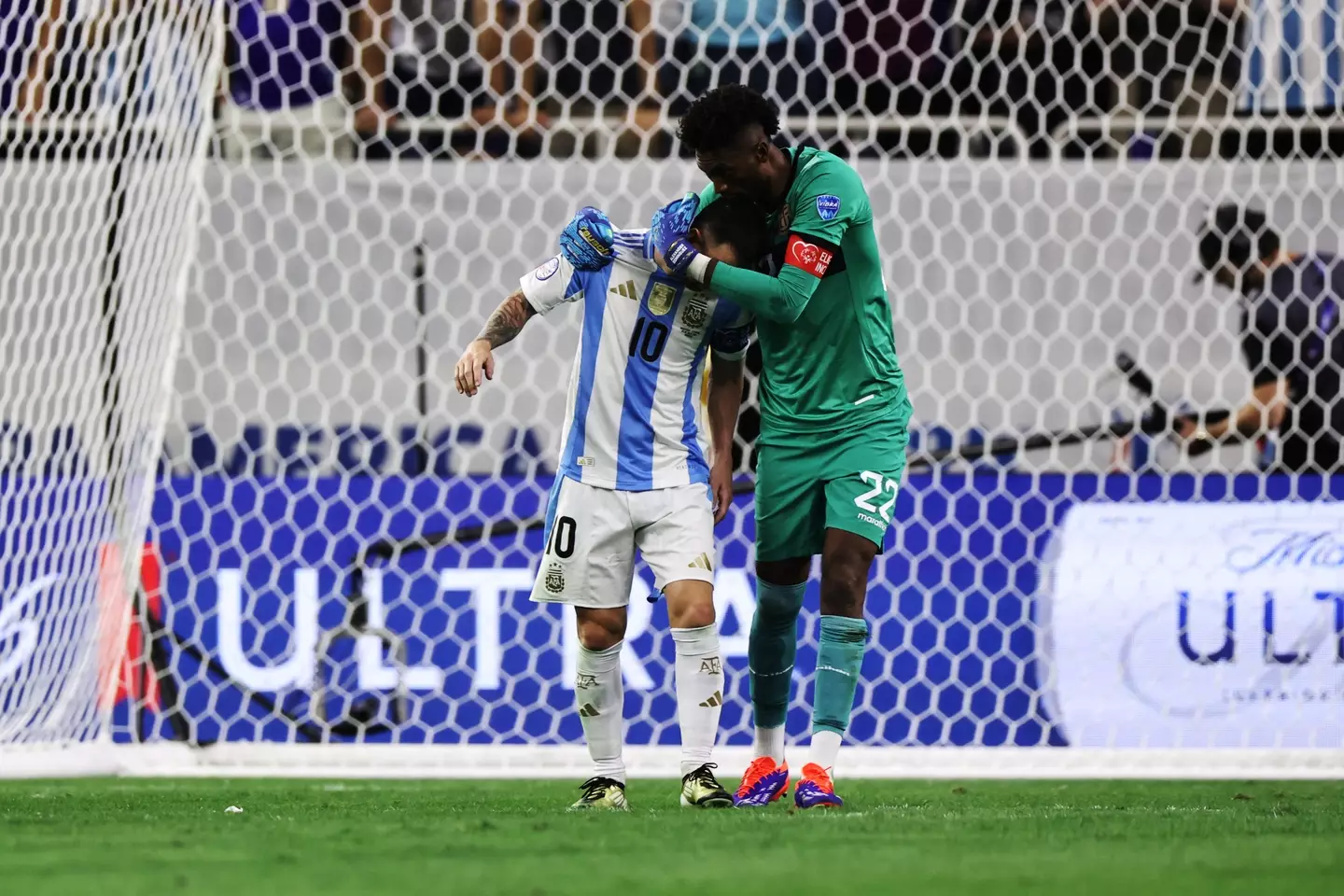 Alexander Dominguez consoles Lionel Messi following his penalty miss. Image: Getty