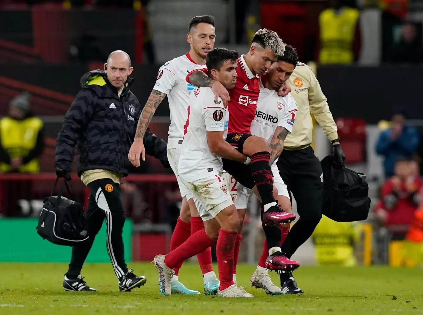Martinez was carried off by Sevilla players. Image: Alamy