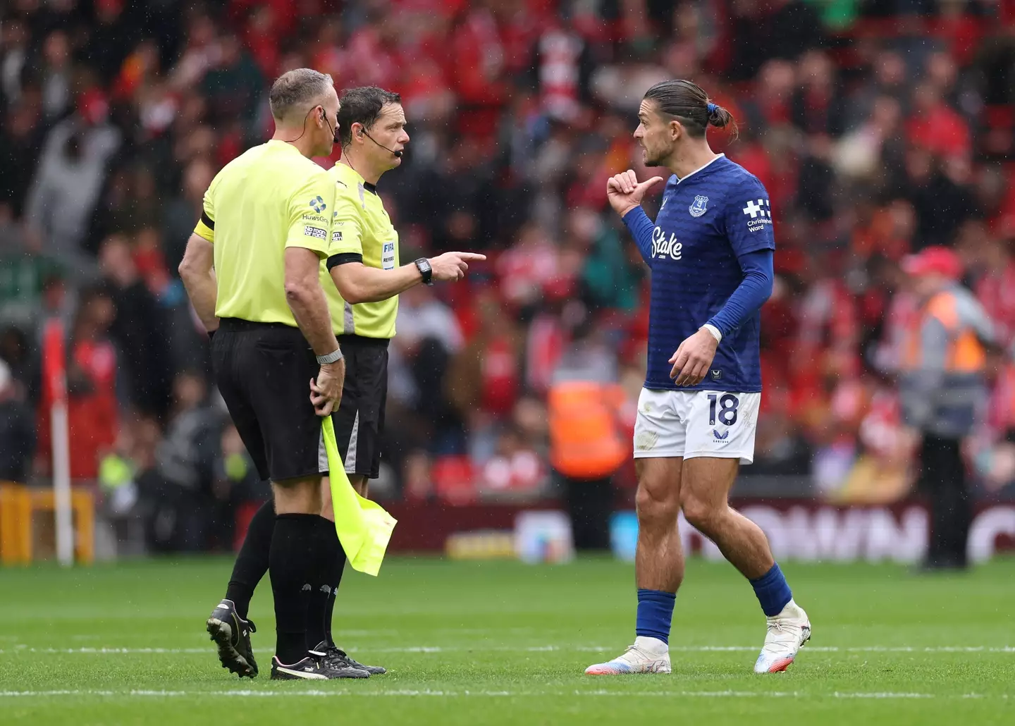 Jack Grealish remonstrates with Darren England during Liverpool vs. Everton. Image: Getty