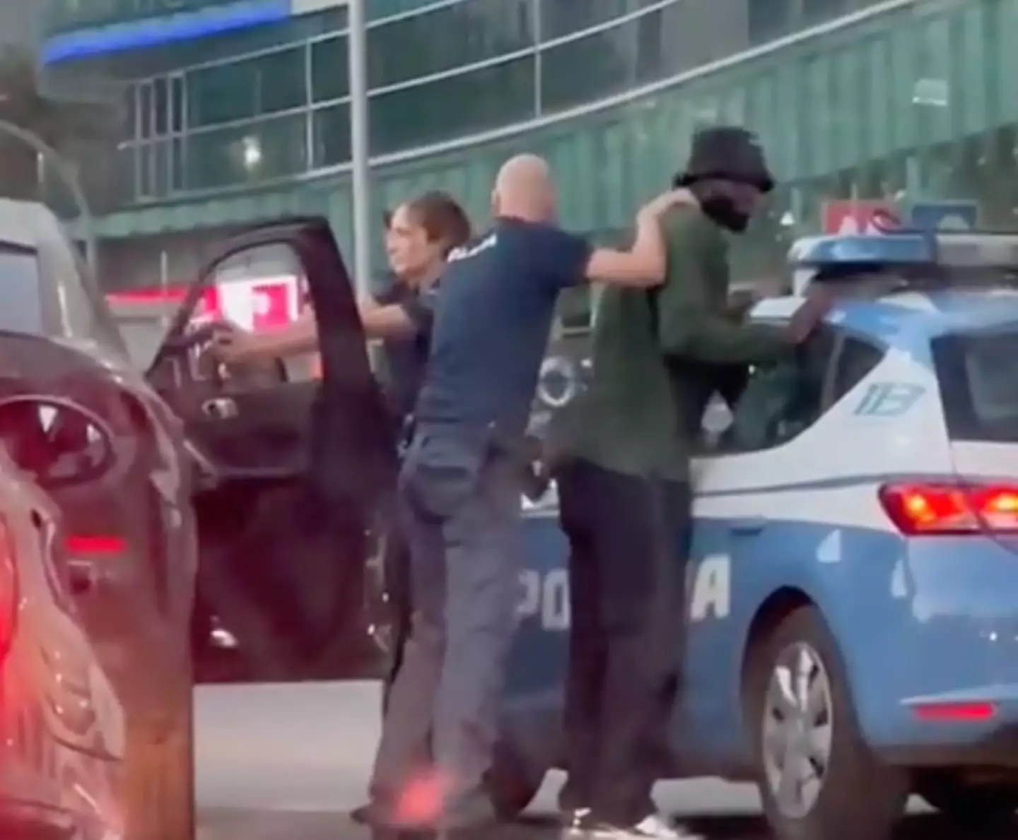 Tiemoue Bakayoko being held by Police in Milan. (Twitter / DrGianlucaFumo)