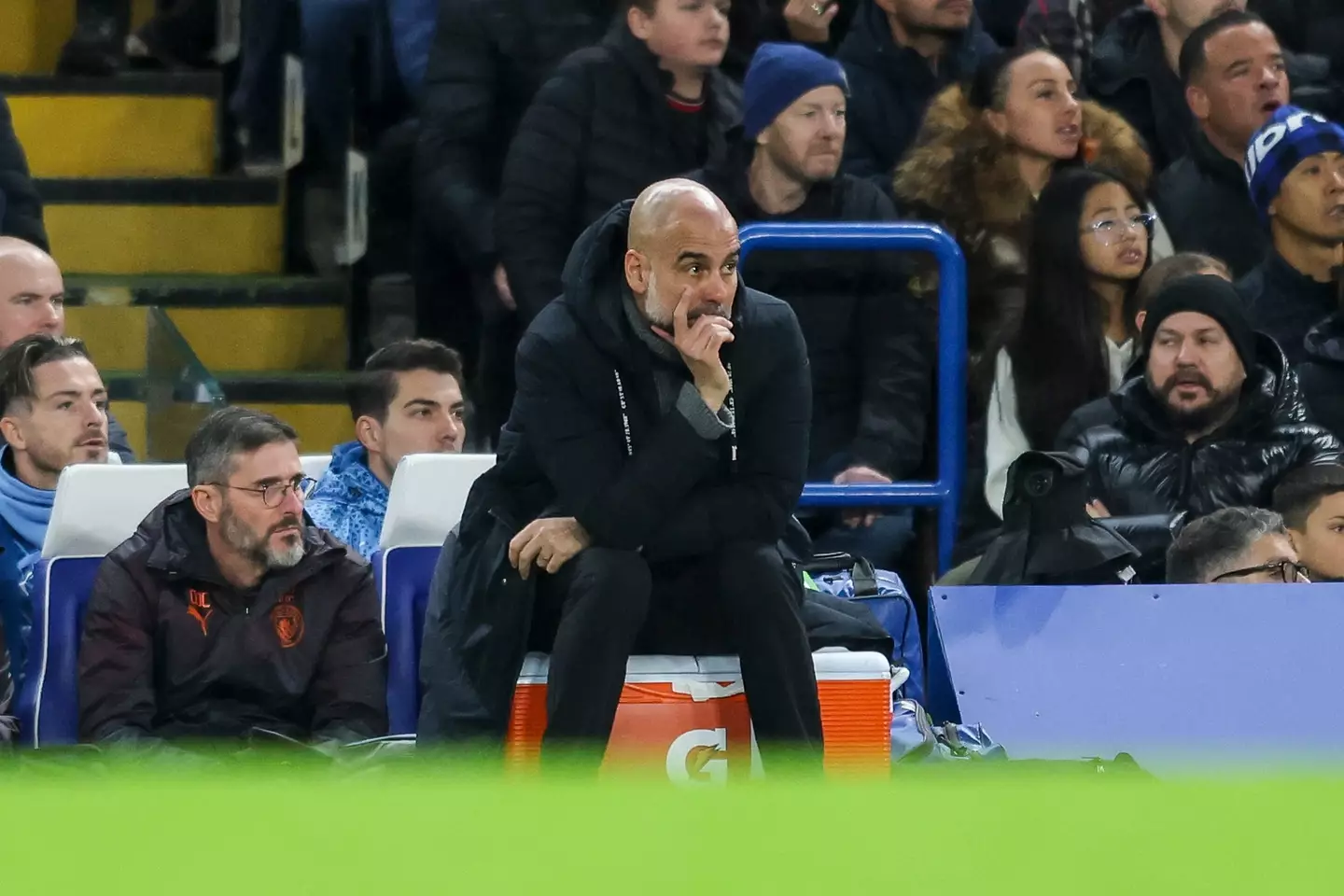 Pep Guardiola on the touchline at Stamford Bridge. Image: Getty