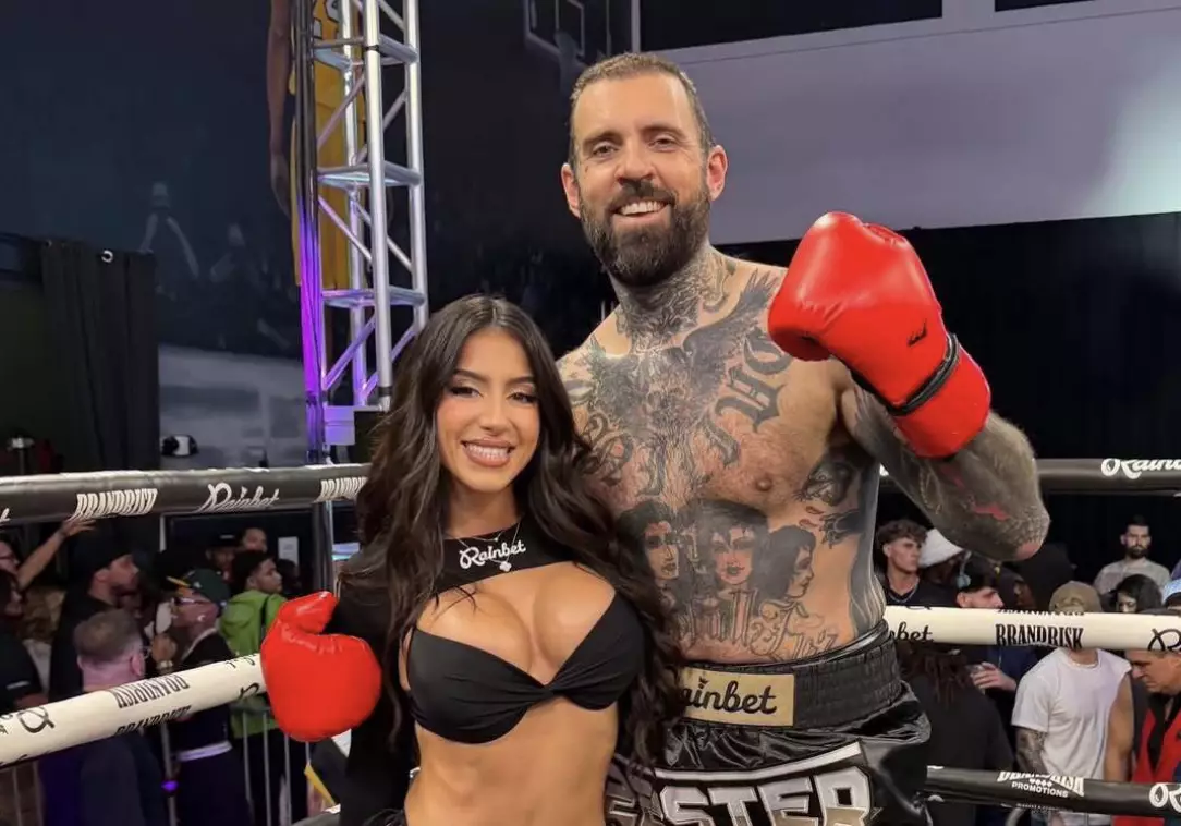 Adam's wife Lena The Plug was the ring girl for his boxing fight with Jason Luv. Image: Instagram/Adam22