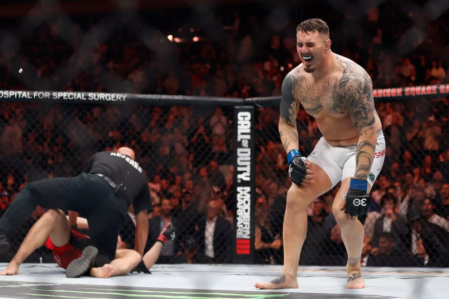 Tom Aspinall celebrates his victory at UFC 295. Image: Getty