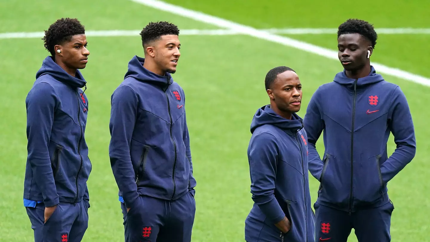 Marcus Rashford and Jadon Sancho wait to warm up for an England game alongside Raheem Sterling and Bukayo Saka (Alamy)